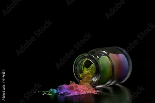 colorful raibow colorant powder in the jar