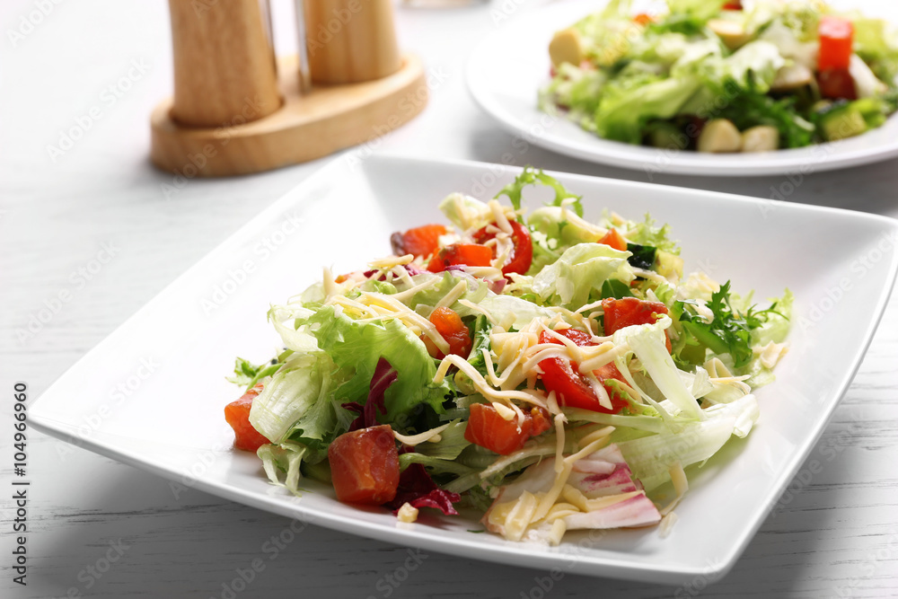Tasty salmon salad on wooden table background Tasty salmon salad on wooden table background