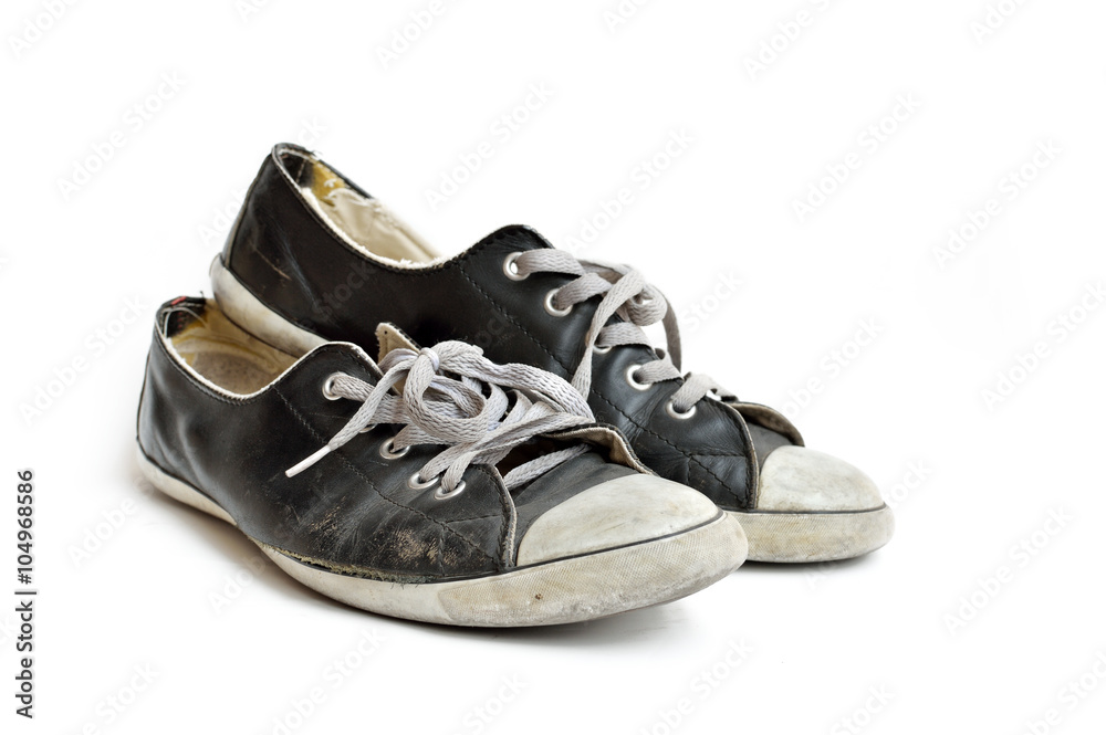 Old & dirty shoes isolated on white background Old & dirty shoes isolated on white background