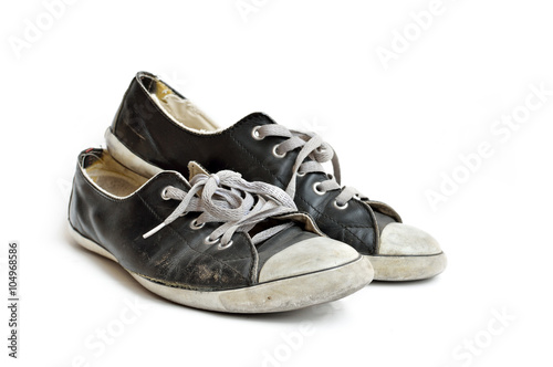 Old & dirty shoes isolated on white background