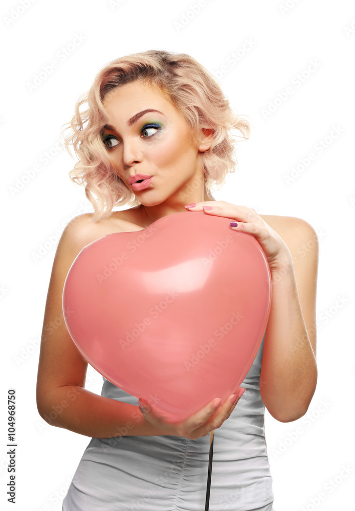 Playful attractive blond girl holding red heart balloon, isolated on white Playful attractive blond girl holding red heart balloon, isolated on white