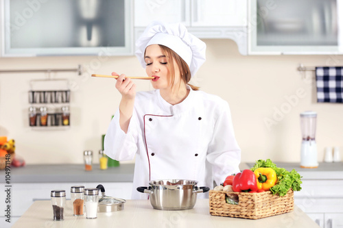 Young woman cooking in the ...