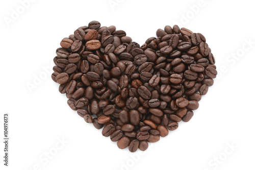 coffee beans in heart shape on white background