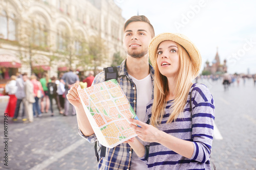 Young couple of travelers i...