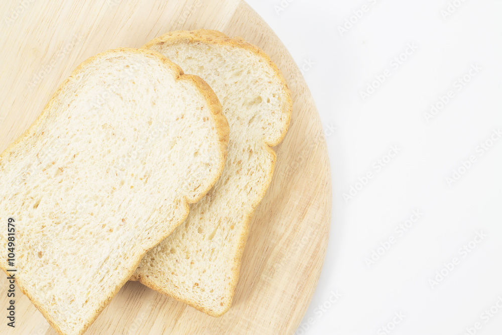 Place the bread on wood isolated white backdrop. Place the bread on wood isolated white backdrop.