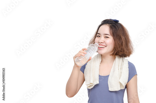 Young Asian girl drinking water from bottle over white