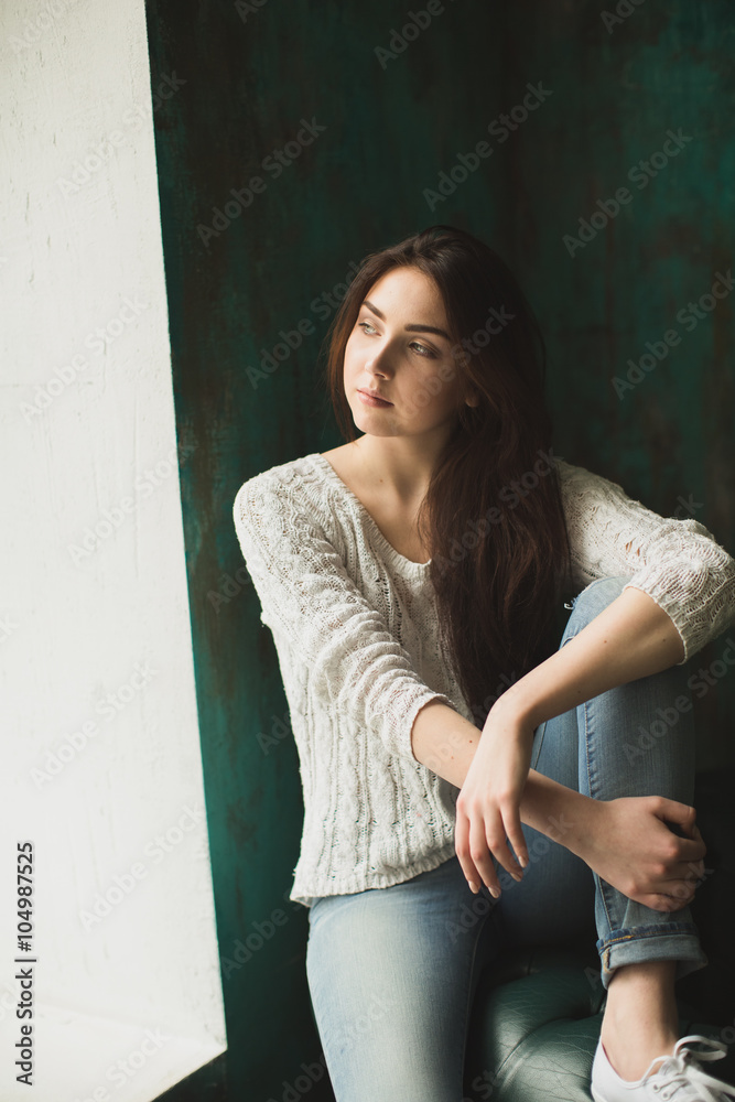 Portrait of young lady in photostudio interior Portrait of young lady in photostudio interior