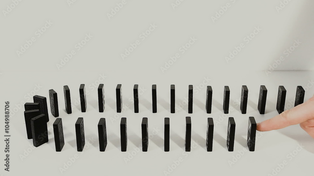 Hand pushing dominoes concept 