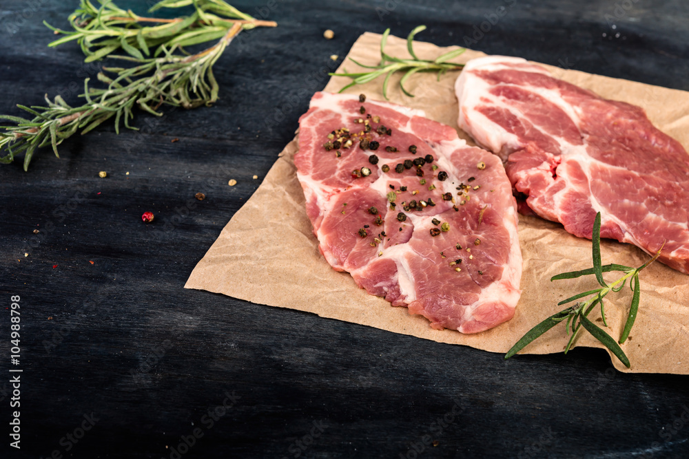 fresh raw  steak with aromatic rosemary and spices, cooking concept.