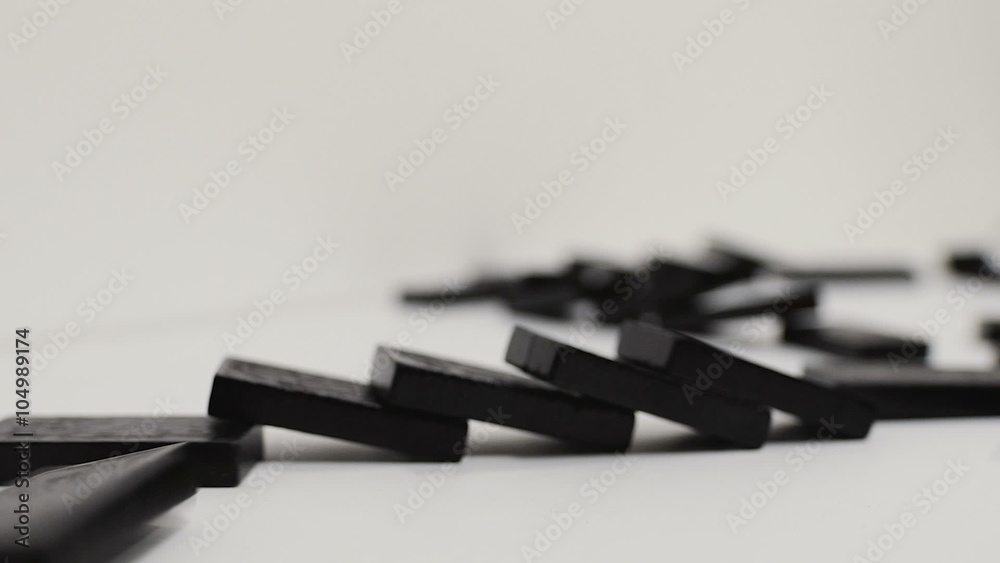 domino effect, black wooden domino line curve