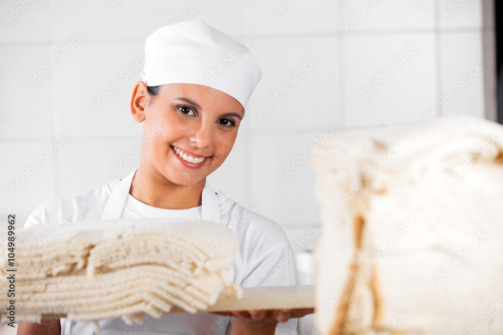 Confident Female Baker With Bread Slices Confident Female Baker With Bread Slices