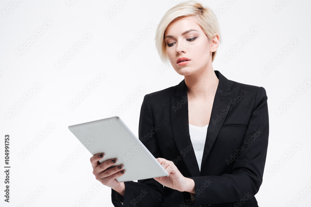 Charming businesswoman using tablet computer Charming businesswoman using tablet computer
