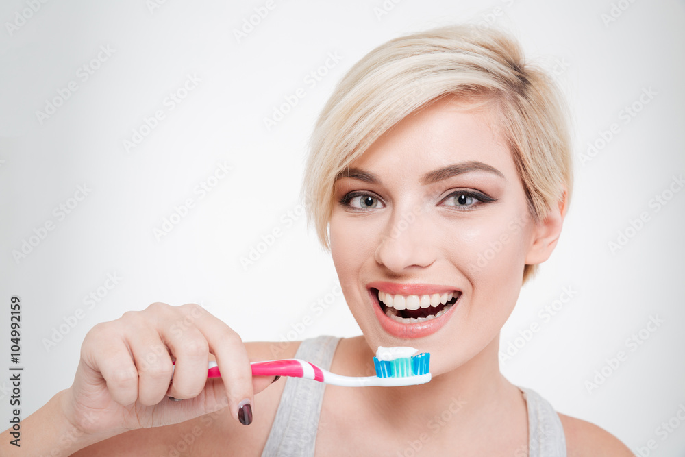 Happy beautiful woman brushing teeth Happy beautiful woman brushing teeth