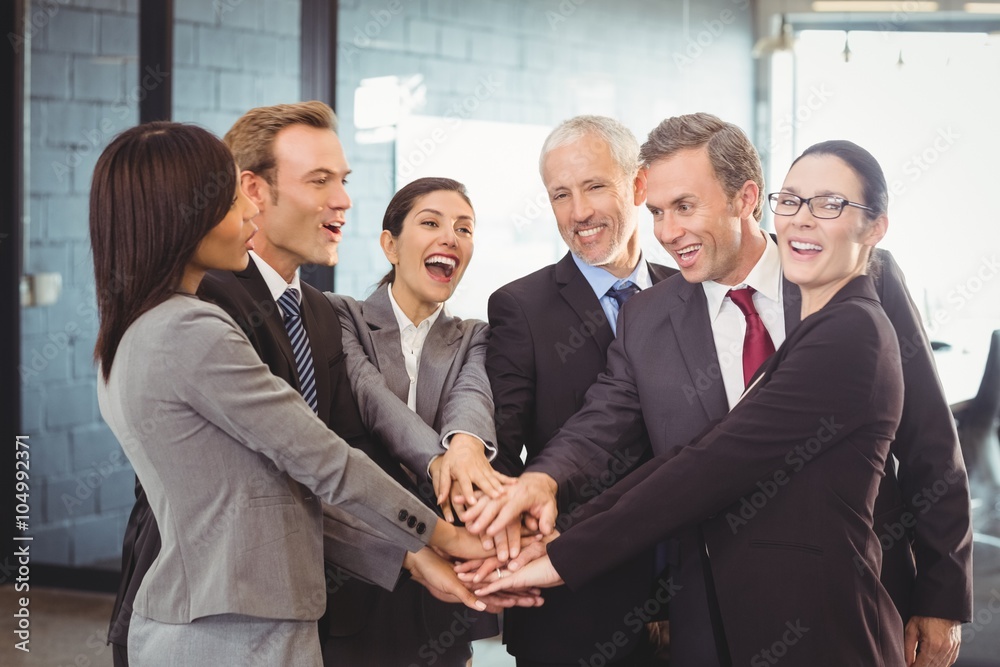 Businesspeople hands stacked over each other Businesspeople hands stacked over each other