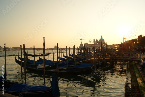 sunset at the pier with a gondola © tania_belova