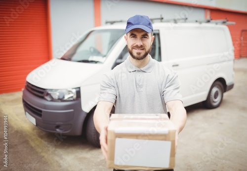 Delivery man holding package © WavebreakMediaMicro