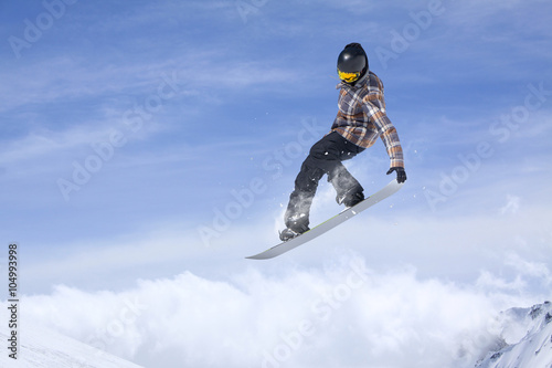 Snowboard jump on mountains. Extreme sport.