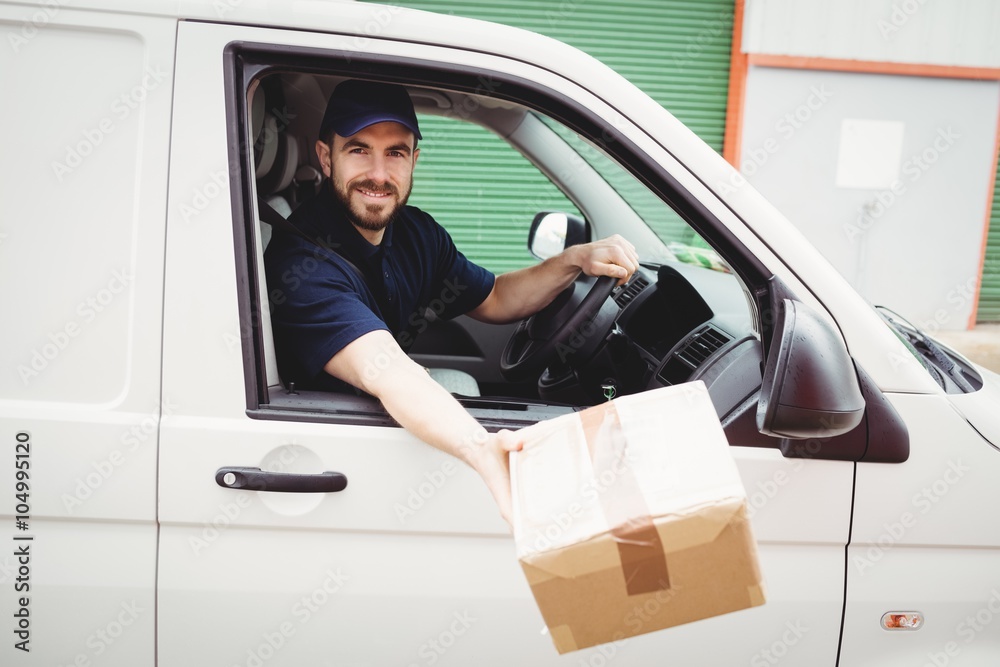Delivery man sitting in his van Delivery man sitting in his van