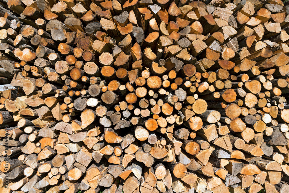 Pile of Chopped Firewood / Background of dry chopped firewood logs in a pile Pile of Chopped Firewood / Background of dry chopped firewood logs in a pile