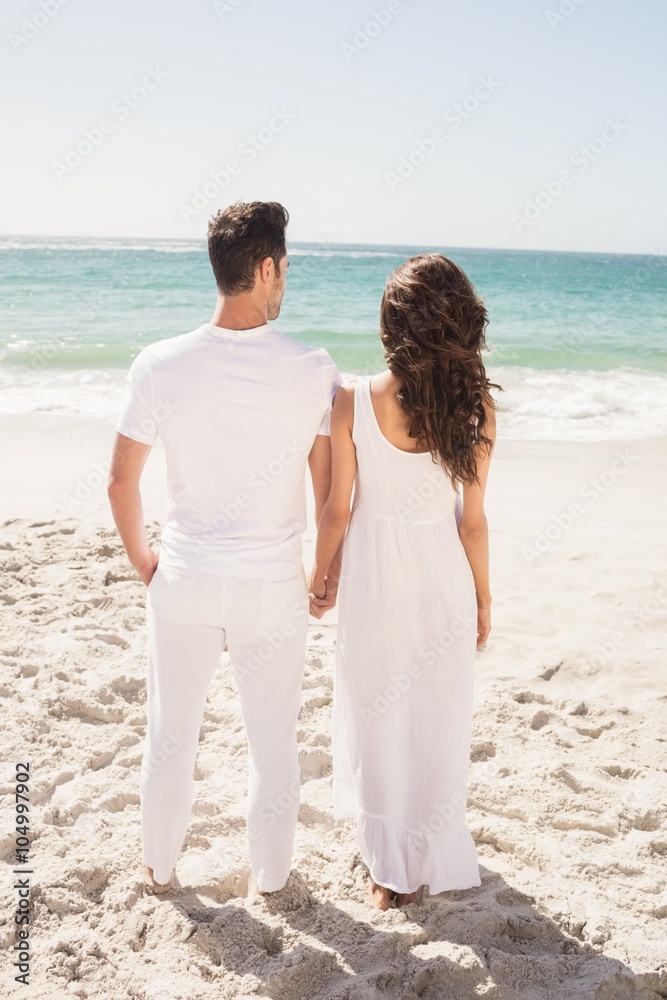 Young couple looking at the beach Young couple looking at the beach