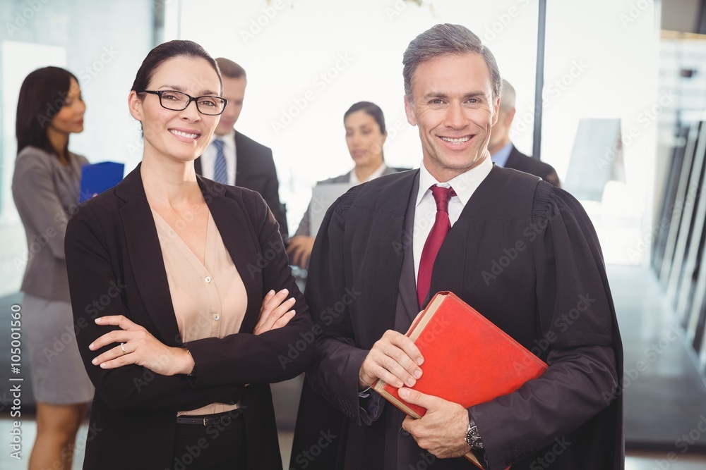Businesswoman standing with lawyer