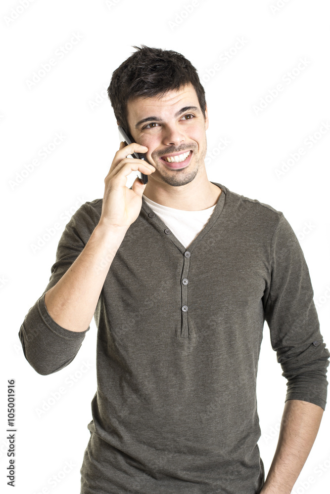 Smiling young man talking with cell phone isolated on a white ba Smiling young man talking with cell phone isolated on a white ba