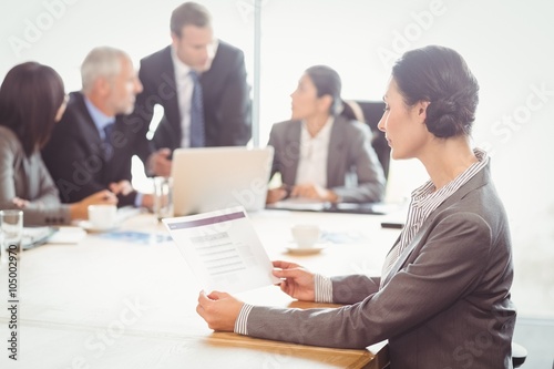 Businesswoman reading a report