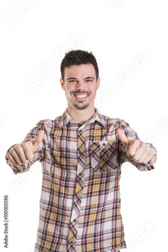 Happy young man with thumbs up on white background © Pablo Carbonell