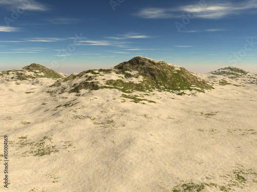 the rocky terrain covered with sand without sky
