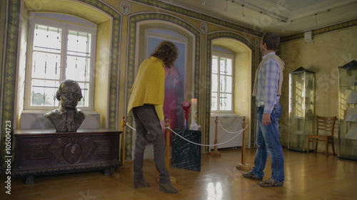 Tourist couple walking in the house museum photo