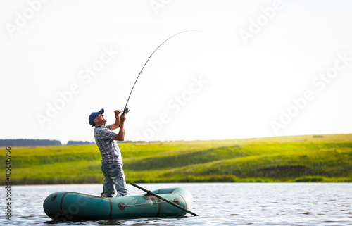 Mature man fishing on the lake