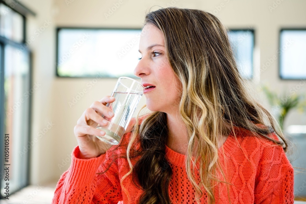 woman drinking a glass of water woman drinking a glass of water