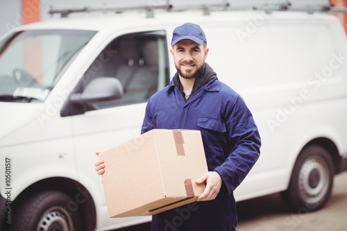 Delivery man holding box © WavebreakmediaMicro