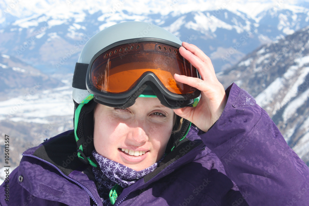 Young woman face in mask and helmet, skiing resort in Austria. Young woman face in mask and helmet, skiing resort in Austria.