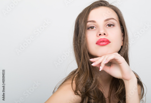 close-up portrait of a beautiful brunette girl with red lips, expresses different emotions