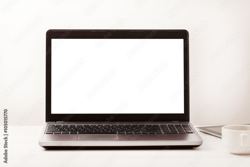 Laptop with blank screen on workplace. Empty space desk white office Interior. Copy space. Business concept. Laptop with blank screen on workplace. Empty space desk white office Interior. Copy space. Business concept.