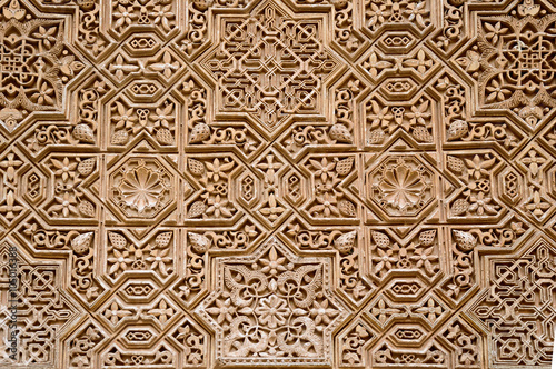 Wall detail with arab ornament in Alhambra, Granada, Spain. photo
