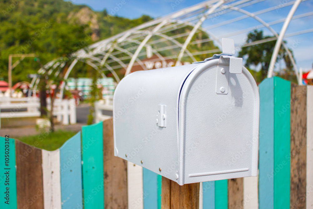 Mail boxes and an antique farm implement in a farming landscape Mail boxes and an antique farm implement in a farming landscape