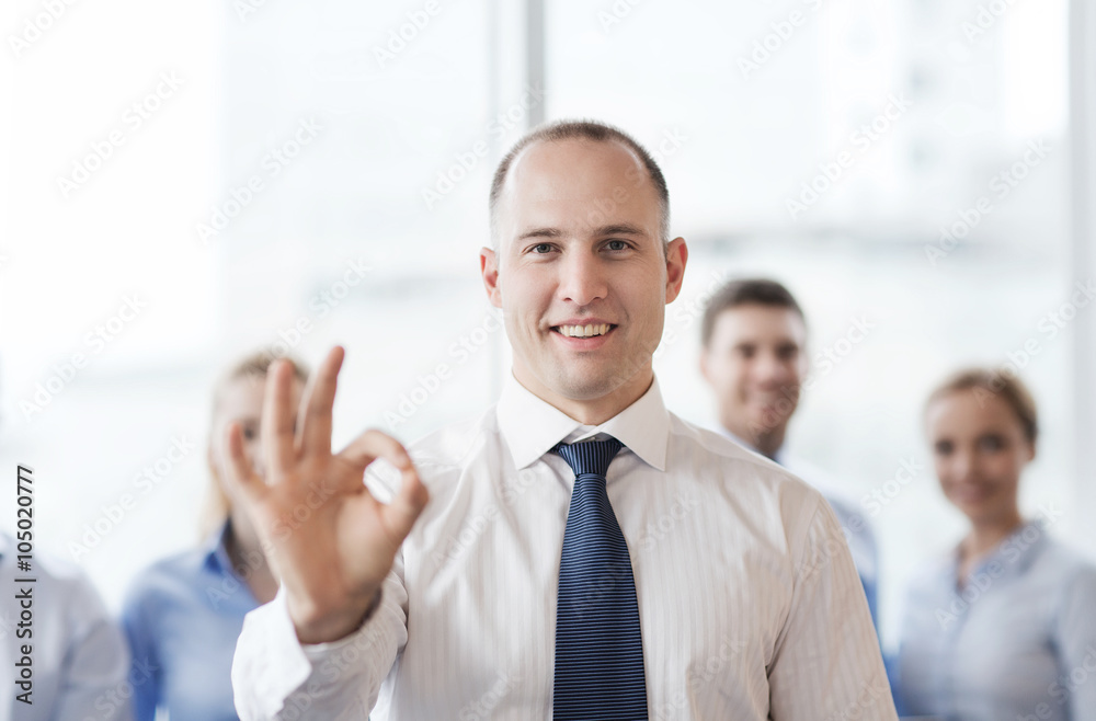 © Syda Productions - smiling businessman showing ok sign in office © Syda Productions - smiling businessman showing ok sign in office
