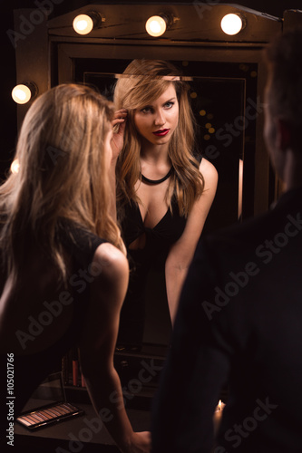 Beautiful blonde reflecting in mirror
