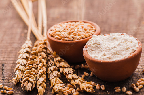Photo  of  fresh wheat grains and flour