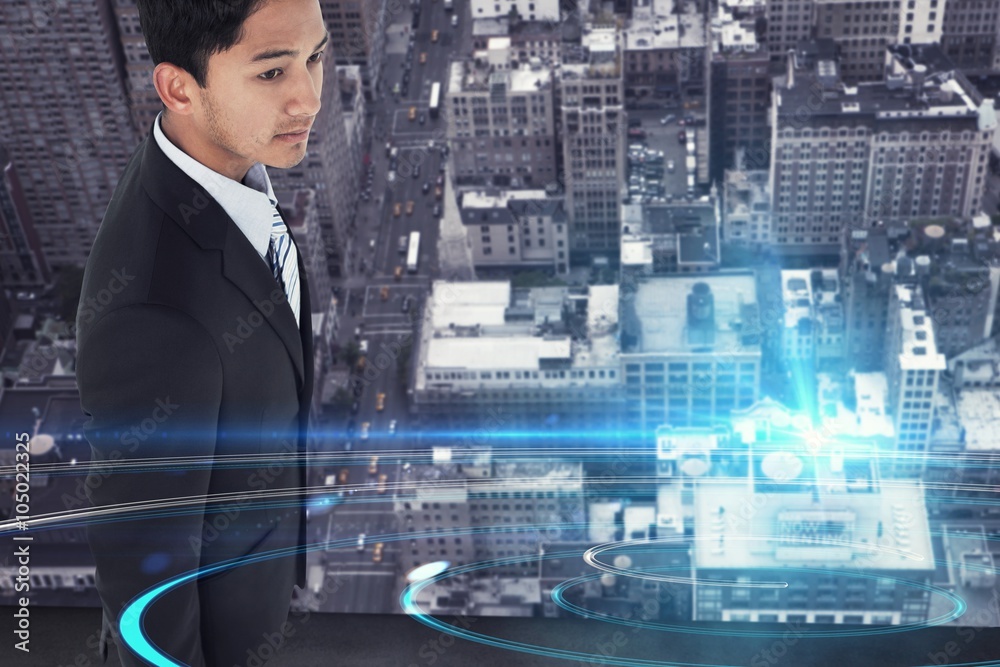 Composite image of serious asian businessman 