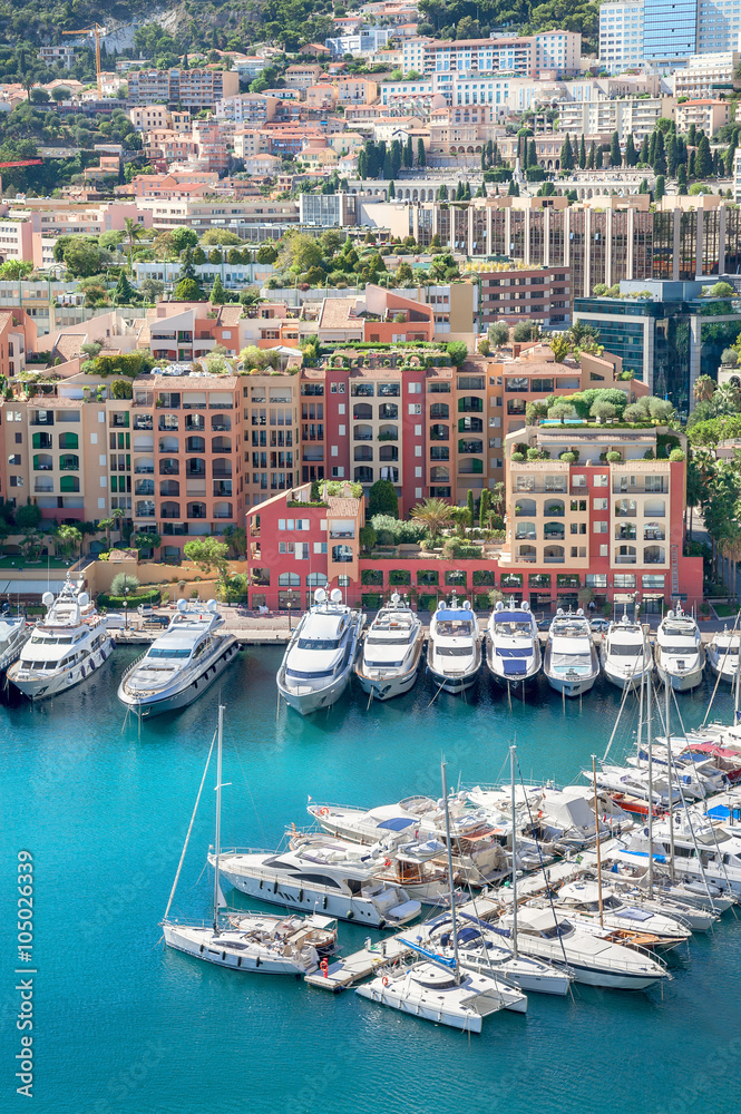 Cityscape with luxury yachts in harbour of Monaco, Cote d'Azur