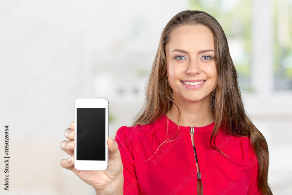 Portrait of beautiful young woman holding smartphone Portrait of beautiful young woman holding smartphone