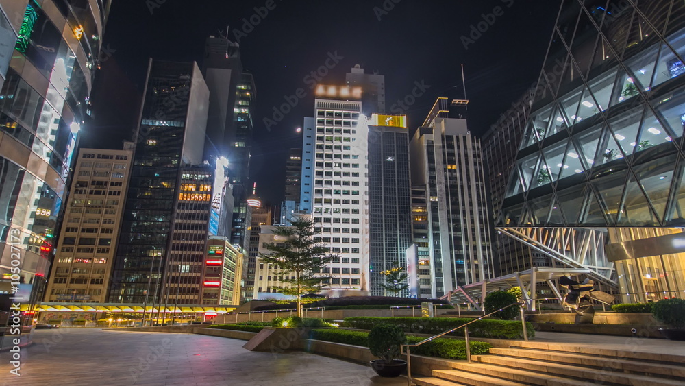 Night view hyperlapse of modern city traffic across street with skyscrapers. Time lapse. Hong Kong Night view hyperlapse of modern city traffic across street with skyscrapers. Time lapse. Hong Kong