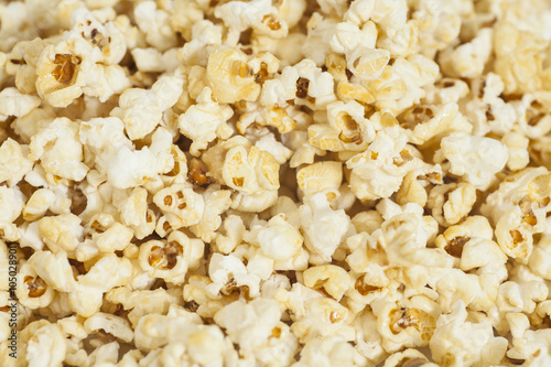 Salted popcorn grains texture background