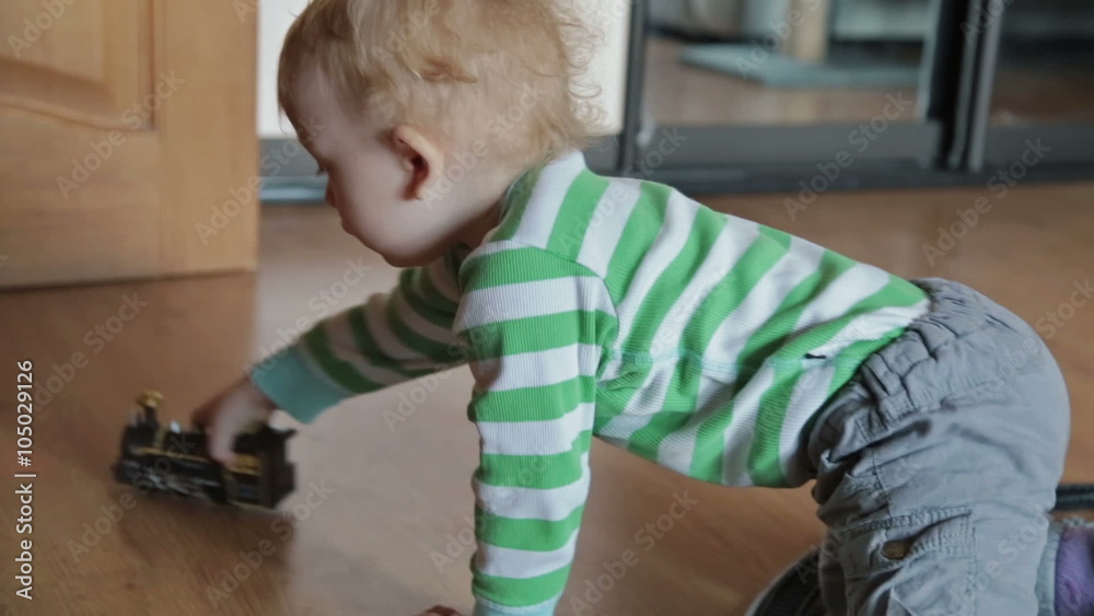Boy playing with toy train