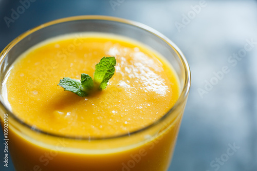 orange smoothie in the glass