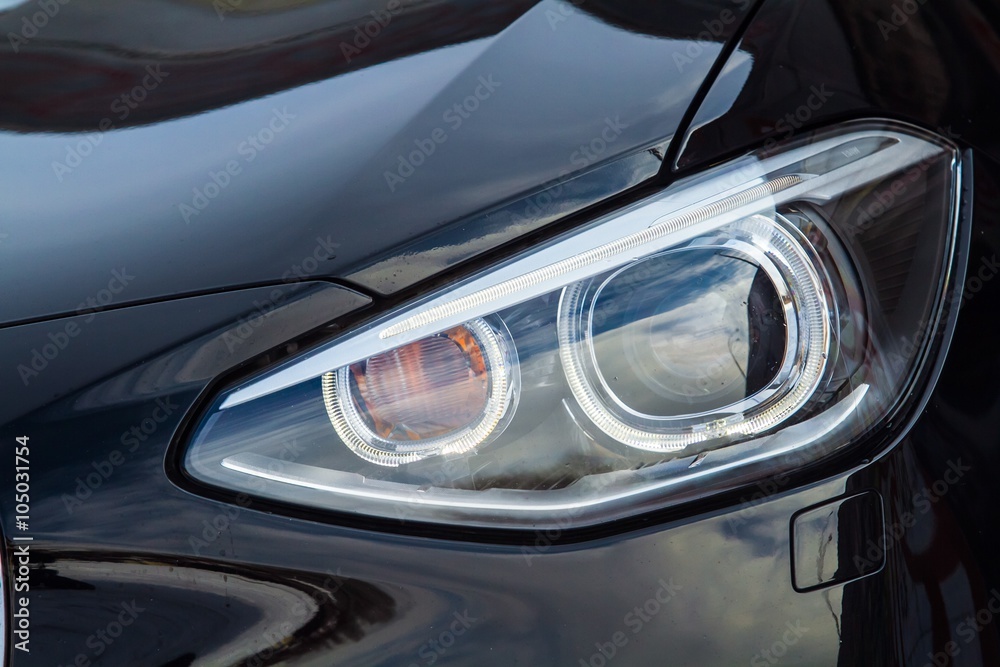 Closeup of headlights of sport car - obrazy, fototapety, plakaty 