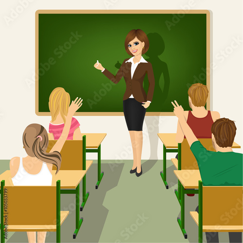 rear view of school lesson with students and teacher in classroom with green chalkboard and desks